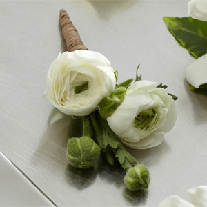 The FTD White Ranunculus Boutonniere